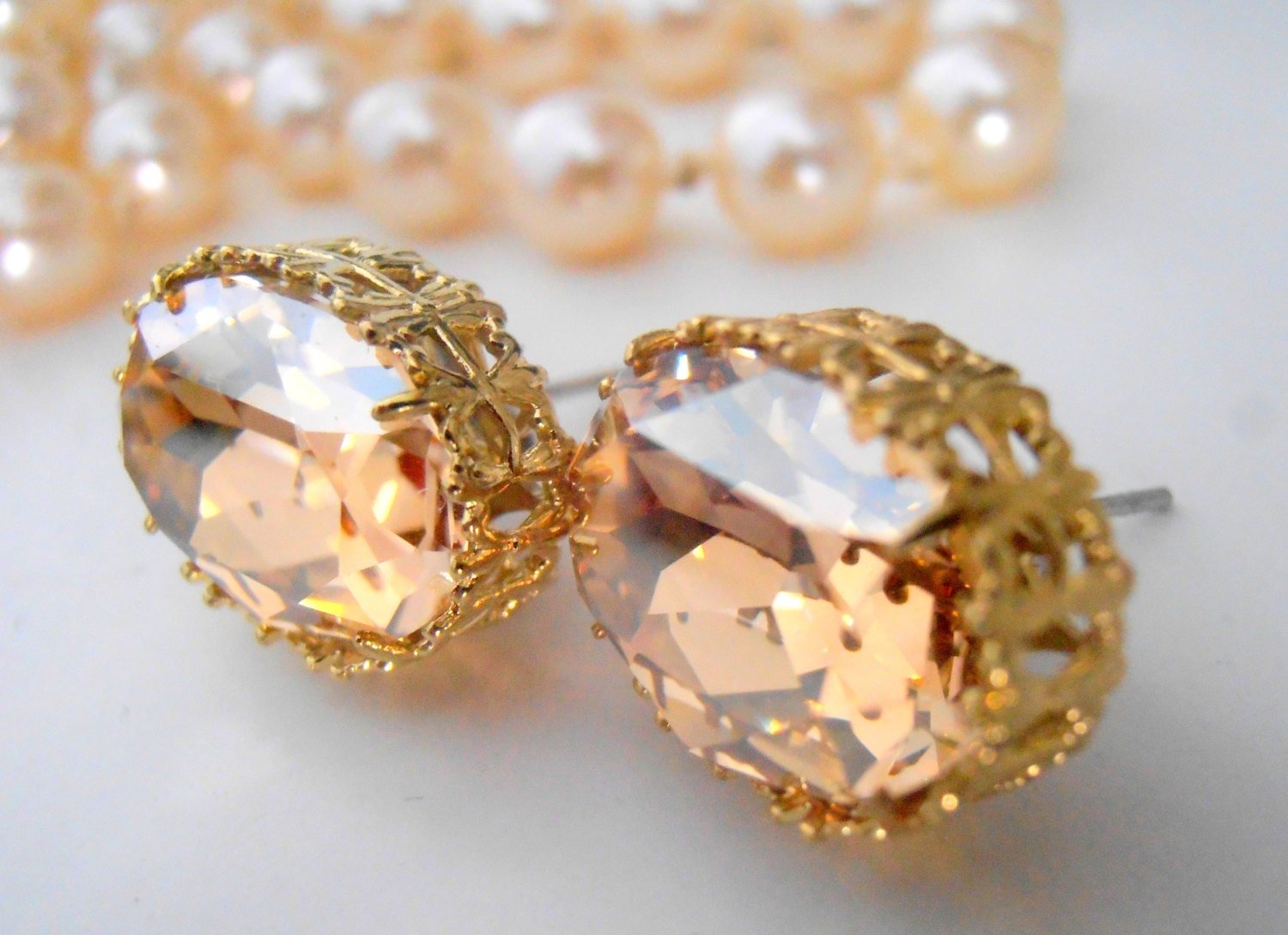 Swarovski oval crystal earrings, golden shadow crystals in a filigree gold plated setting