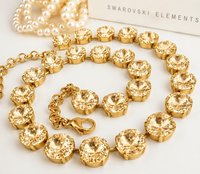Gold tone double strand rhinestone necklace with sparkling Golden Shadow crystals close up