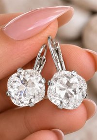 Vintage style Swarovski crystal drop earrings with 12mm clear cushion cut crystals in silver plated leverback settings.