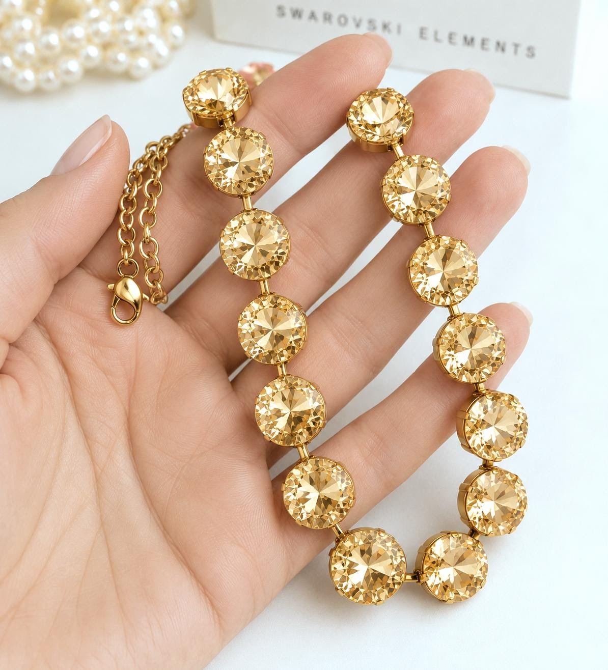 Statement wedding necklace with layered rivoli crystals in warm champagne gold tones