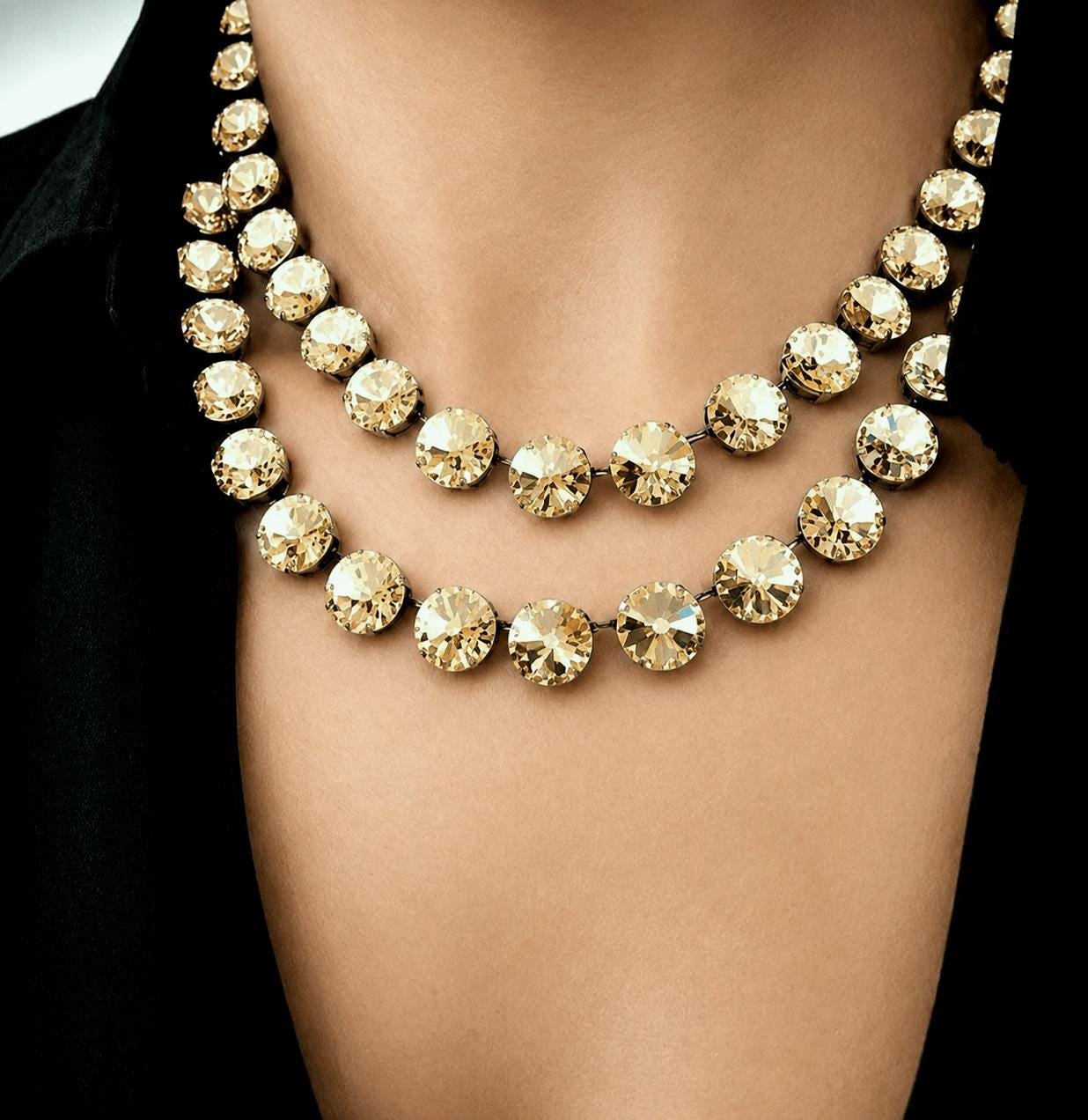 Double strand Golden Shadow rivoli crystal necklace in gold settings on model wearing black blouse