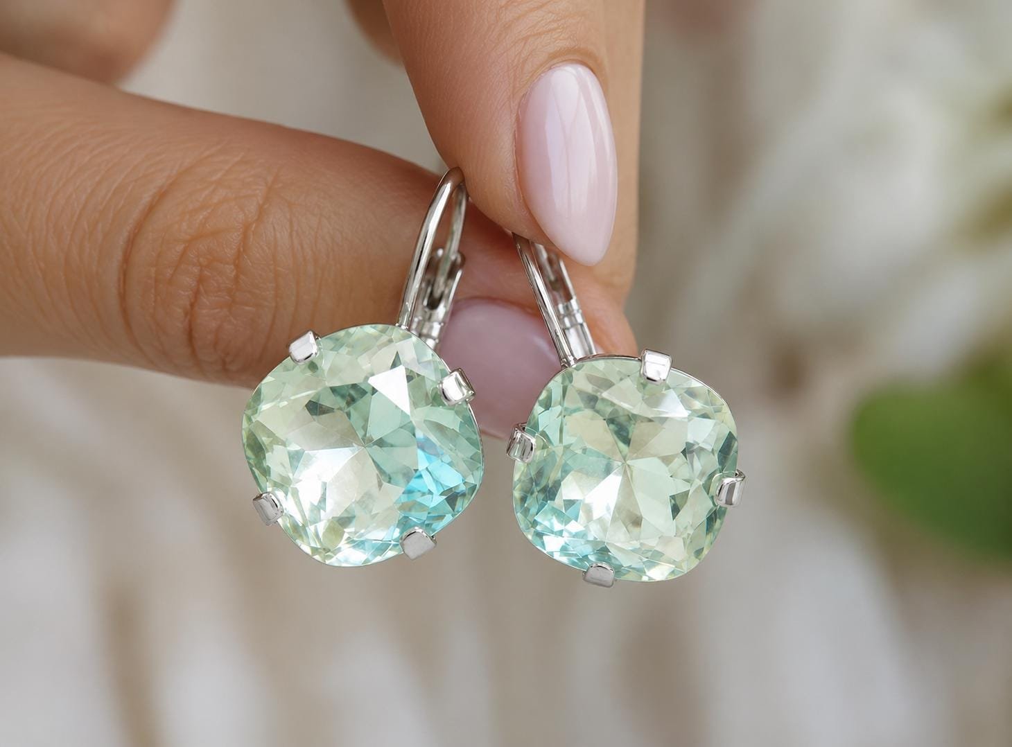 Elegant light blue crystal earrings with silver leverback hooks, handmade for everyday wear or special occasions.