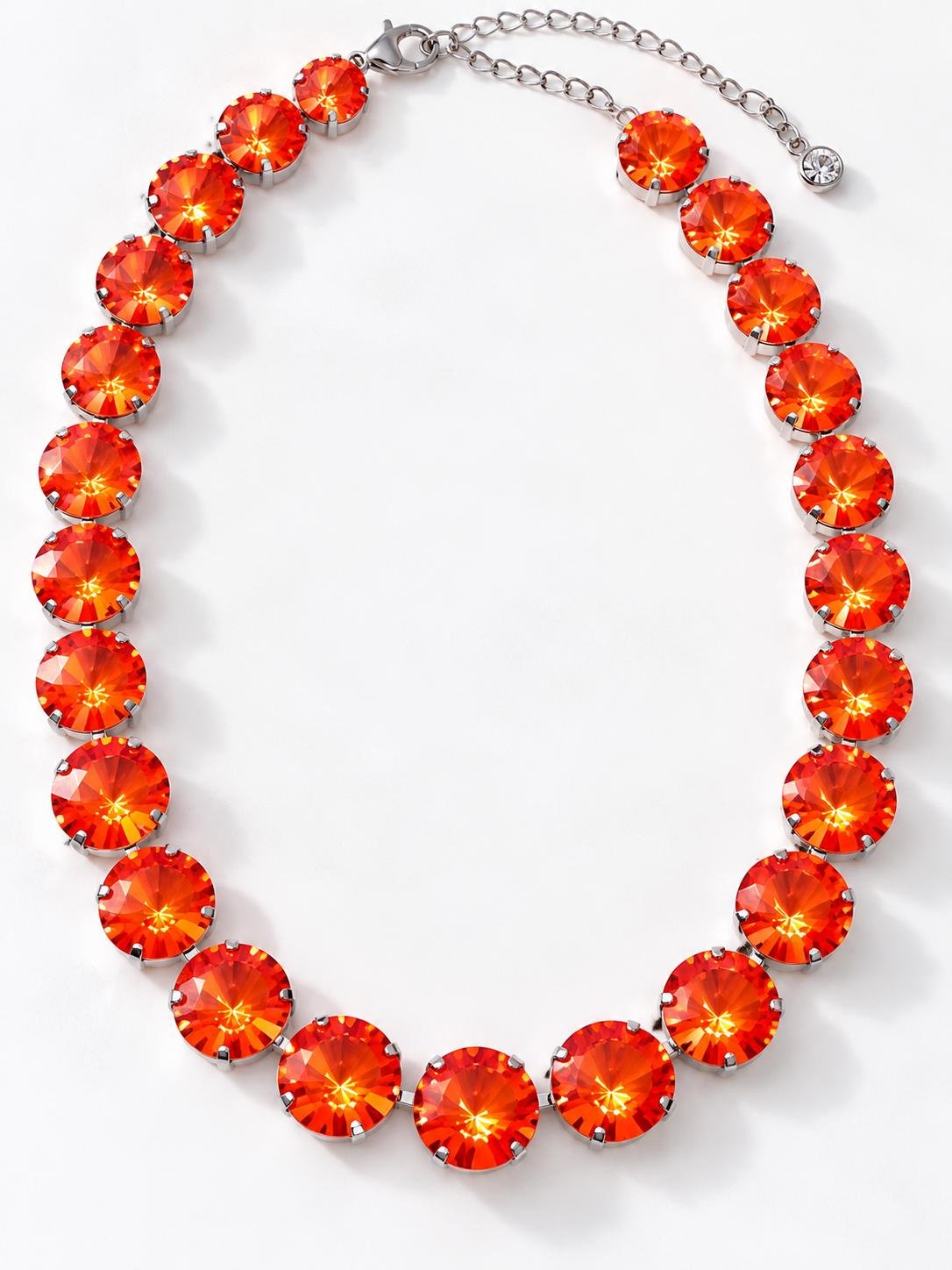 Handmade Swarovski orange Rivoli crystal necklace displayed on a white surface in a silver plated cup chain round setting.