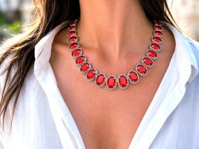 Vintage inspired red crystal statement necklace featuring oversized oval rhinestones in ornate platinum settings with elegant Art Deco style details